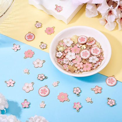 KISSITTY 100Pcs Light Gold Alloy Enamel Charms Cherry Blossom Flower Charm Bulk Gold Plated Pendant Cute Small Floral Dangle Charms for DIY Jewelry Making Kit Bracelet Necklace Keychain Crafts