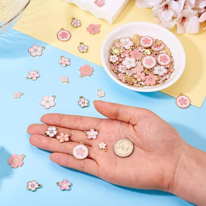KISSITTY 100Pcs Light Gold Alloy Enamel Charms Cherry Blossom Flower Charm Bulk Gold Plated Pendant Cute Small Floral Dangle Charms for DIY Jewelry Making Kit Bracelet Necklace Keychain Crafts