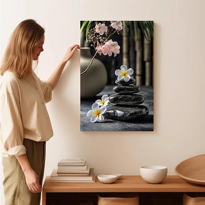A harmonious black stone stack paired with white and pink flowers bamboo and ceramic vases creates a tranquil Zen decor for minimalist homes and mindful spaces 16x24in Wood Framed