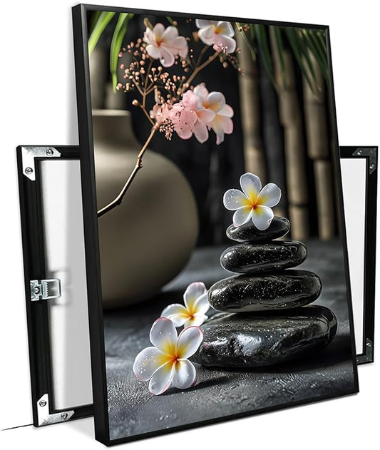 A harmonious black stone stack paired with white and pink flowers bamboo and ceramic vases creates a tranquil Zen decor for minimalist homes and mindful spaces 16x24in Metal blackFramed
