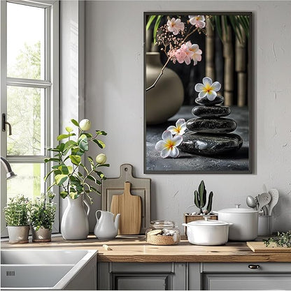 A harmonious black stone stack paired with white and pink flowers bamboo and ceramic vases creates a tranquil Zen decor for minimalist homes and mindful spaces 20x30in Metal blackFramed