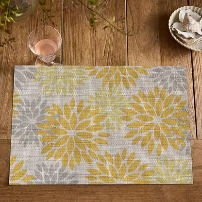 Artoid Mode Floral Plastic Placemats Set of 4, 12x18 Inch Washable Non-Slip Plastic Vinyl Place Mats for Party Kitchen Dining Decor, Yellow