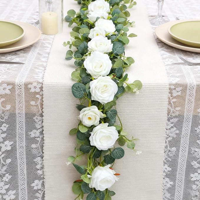 6FT Artificial Eucalyptus Garland with 14 Fake White Rose Flowers - Floral Greenery Decoration Vine for Runner, Backdrop, Arch Wall Decor,Indoor/Outdoor, (1 PCS)