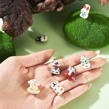 Beadthoven 7Pcs Animals Ceramic Beads, Assorted Printed Handmade Porcelain Beads Colorful Pattern Cow Rabbit Dog Penguin Loose Craft Spacers for DIY Crafts Bracelet Earring Necklace Jewelry Making